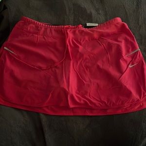 Pink Nike dri fit skirt with built in shorts.